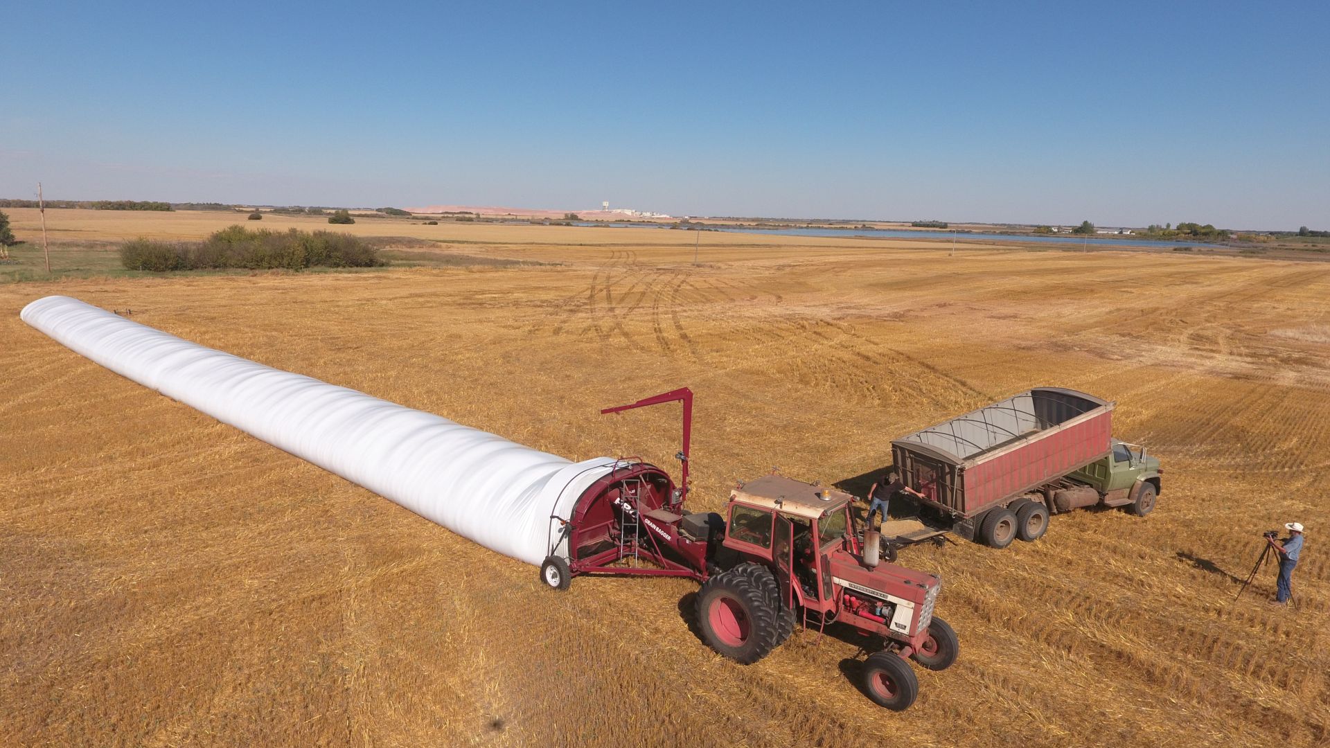 Aerial view of grain bagger in the field